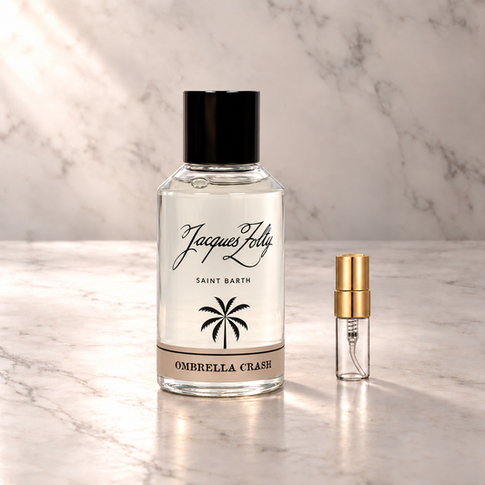 Jacques Zolty Ombrella Crash Eau de Parfum mit 3-ml-Duftprobe aus Glas mit Goldkappe auf hellem Marmor
